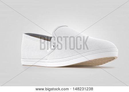 Blank grey slip-on shoe design mock up isolated clipping path 3d rendering. Plain hipster slipon mockup template stand profile view. Urban skate boot with clear label presentation.