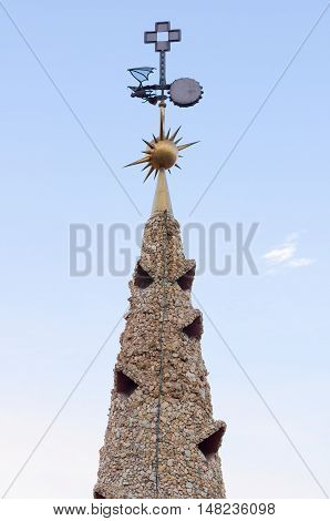 BARCELONA, SPAIN - SEPTEMBER 20, 2014: Design of the roof of Palace Guell - Gaudi Chimney: broken tile mosaics and strange decorated chimneys are evident in his early work.