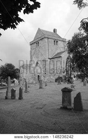 A view across a graveyard to Crichton collegiate church
