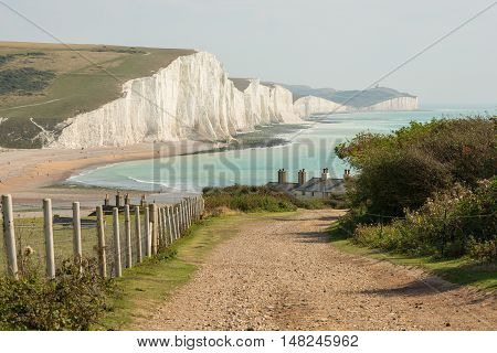 View towards the Seven Sisters chalk cliffs and Beachy Head from Seaford Head. East Sussex England