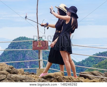 Semporna,Sabah-Sep 10,2016:Tourists enjoying amazing view from viewpoint National Park on top of Bohey Dulang island Semporna,Sabah.The bright blue water & rocky shore in the island of Semporna