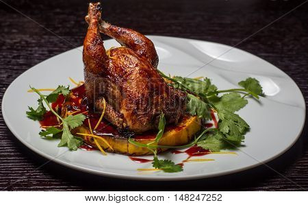 baked chicken on a bed of pumpkins