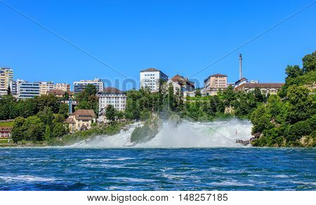 The Rhine Falls waterfall on the Rhine river in Switzerland in summertime.