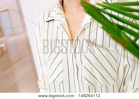 beautiful white striped woman blouse shirt fashion details close up