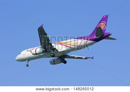 CHIANGMAI, THAILAND -JANUARY 7 2013: HS-TXC Airbus A320-200 of Thaismile airway. Landing to Chiangmai airport from Bangkok Suvarnabhumi.