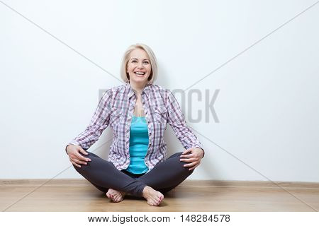 attractive middle aged woman relaxing at home