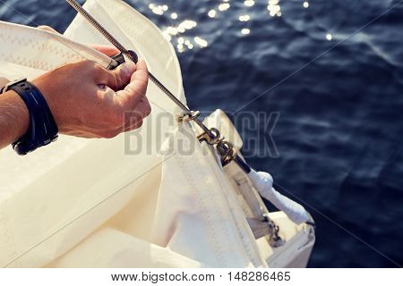 Preparing before lifting staysail sails. Before going out into the sea