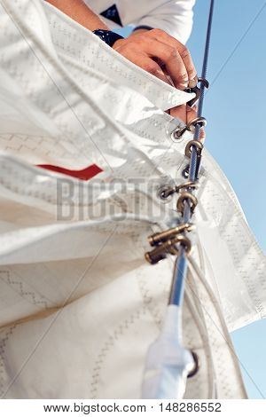Preparing before lifting staysail sails. Before going out into the sea
