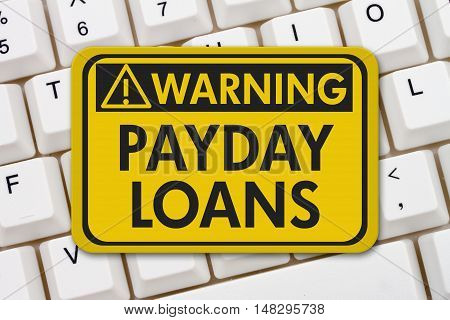 Online Payday Loans Warning Sign A yellow warning sign with text Payday Loans on a keyboard, 3D Illustration