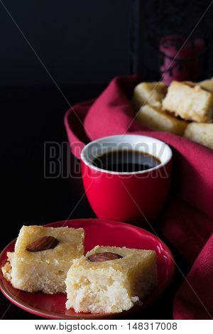Basbousa and Coffee with Dark Background Vertical with Copy Space