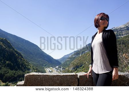 Girl in a view of Canfranc station in Pyrenees Spain