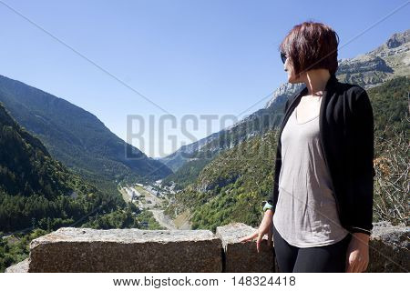 Girl in front of Canfranc station in Pyrenees Spain
