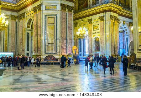 SAINT PETERSBURG RUSSIA - APRIL 25 2015: The prayer hall of St Isaac's Cathedral with the colorful stone walls and floor covered with patterns on April 25 in Saint Petersburg.