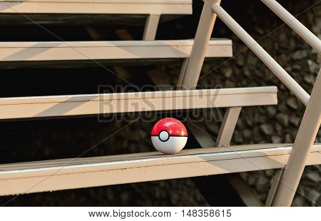 Irkutsk, Russia - September 15, 2016: Issue 2016 Image: Fan Art and Pokebol Pikachu Pokemon smartphone. Play Pokeball - this equipment to catch Pok mon in the game Pok mon go.