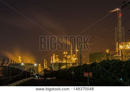 beautiful lighting of oil refinery plant in heavy petrochemical industry park use for power energy and petroleum industrial topic