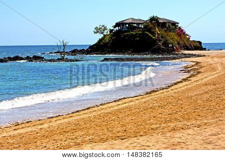 Beautiful Andilana Beach Seaweed  Indian  House Sky And Rock
