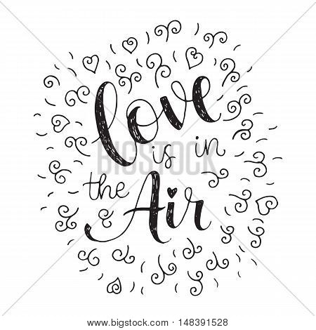 Love is in the air. Valentines day hand lettering greeting card.