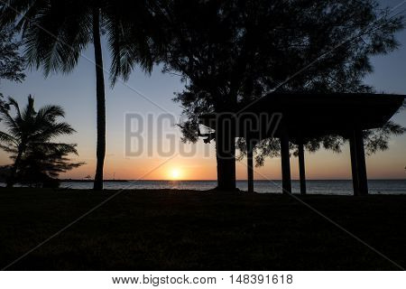 Tropical beach landscape with a trees silhouettes during sunset at Kg.Pohon Batu LABUAN F.T MALAYSIA, January 2016