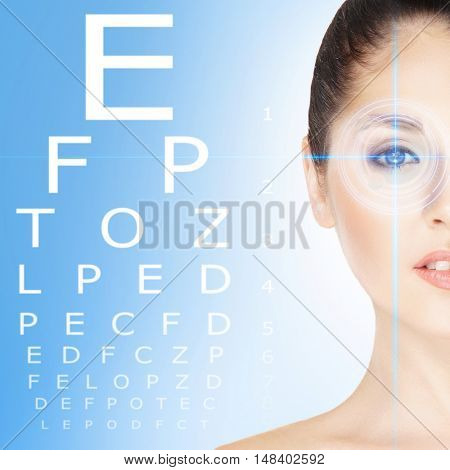 Beautiful girl with laser surgery concept over blue background.
