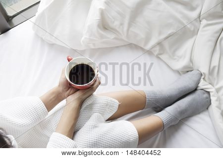 Relaxing With Hot Coffee On The Bed In The Morning.