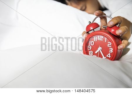 Girl Turns Off The Alarm Clock Waking Up In The Morning From A Call
