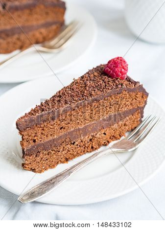 Piece of paleo flourless gluten free chocolate cake.