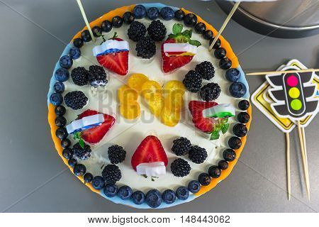 Beautiful berry tart with blueberries, strawberries and blackberries