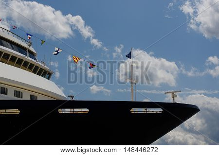 view to the front part of cruise liner moored in the seaport. Closeup. right side