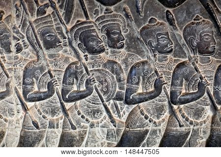 Ancient bas-relief at the facade of Angkor Wat in Angkor, Cambodia. Angkor Wat was built between 1113 and 1150 by King Suryavarman II.