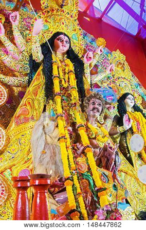 KOLKATA INDIA - OCTOBER 21 2015 : Beautiful interior of decorated Durga Puja pandal at Kolkata West Bengal India. Durga Puja is biggest religious festival of Hinduism.