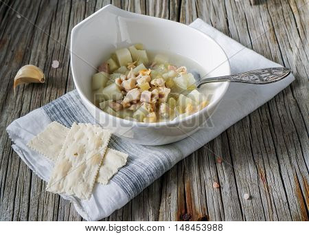 Rhode Island Clam Chowder Soup on Wood Background, selective focus.