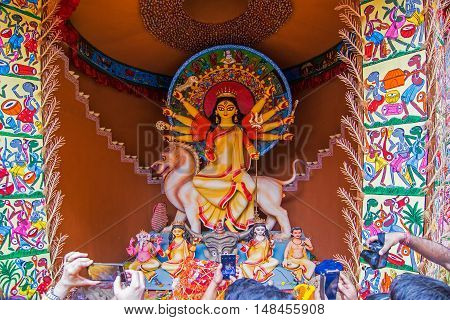 KOLKATA INDIA - OCTOBER 21 2015 : Beautiful interior of decorated Durga Puja pandal at Kolkata West Bengal India. Durga Puja is biggest religious festival of Hinduism.