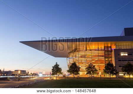 Copenhagen, Denmark - July 28, 2016: The illuminated Opera House designed by Henning Larsen architects by night