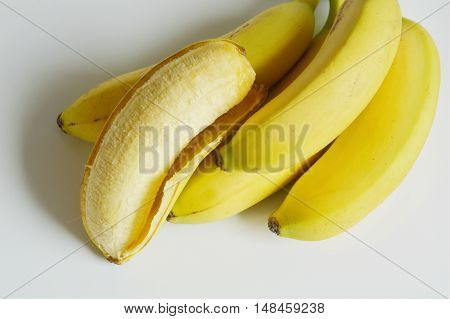 fresh peeled golden banana on white background