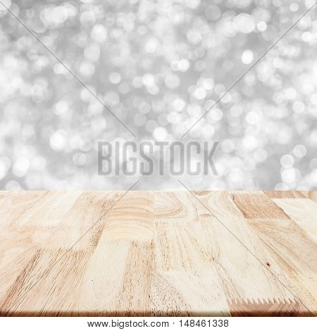 Modern wood table with grey blurry background for display your product.