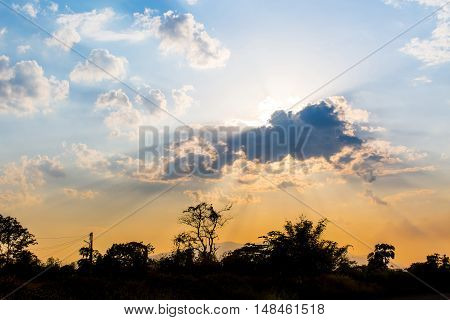 silhouette with ray light of sun in evening