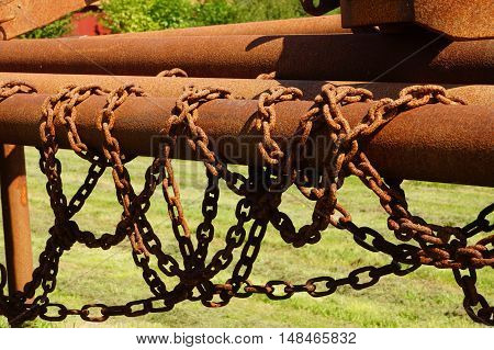 Old rusty iron piles and iron chains