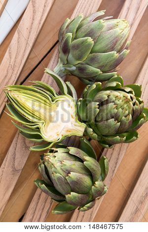 Ripe Organic Artichokes On The Wooden Lattice