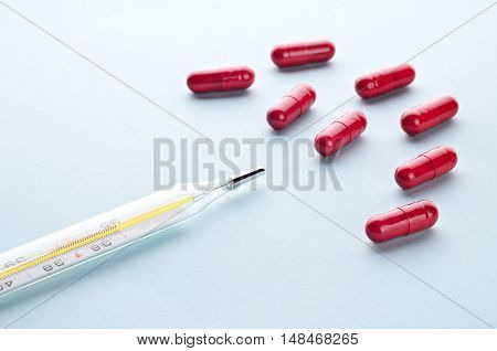 Pills And Capsules And Thermometer