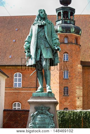 The statue of Chancellor Peder Griffenfeld and a tower in Copenhagen Denmark