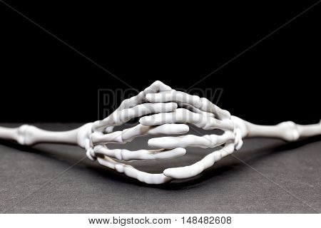 A hands interlace in waiting position on the table