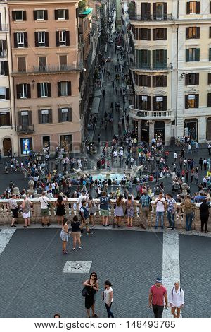 ROME ITALY - JUNE 11 2015: Spanish Steps and Via Condotti in Rome. This street is the center of fashion shopping in Rome with the atelier of Bulgari Armani Cartier Fendi Gucci  and others.