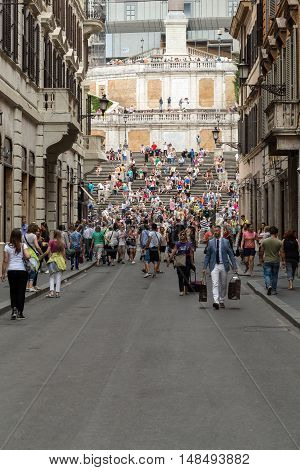 ROME ITALY - JUNE 15 2015: Spanish Steps and Via Condotti in Rome. This street is the center of fashion shopping in Rome with the atelier of Bulgari Armani Cartier Fendi Gucci  and others.
