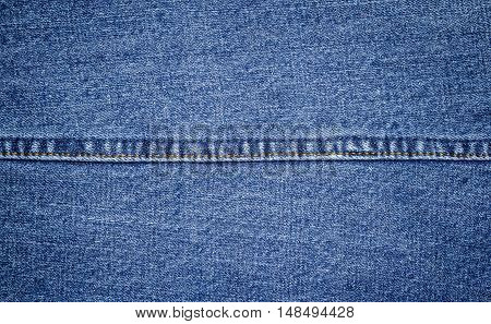 Closeup of denim jeans texture with seams.You can apply for jean background, jean backdrop, jean wallpaper and everything about denim and jean background for you design.