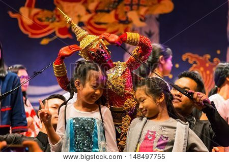BANGKOK, THAILAND - JANUARY 16: Thai traditional puppet play displayed openly for public at Thai Cultural Center in a campaign for the conservation of Thai traditional performing arts