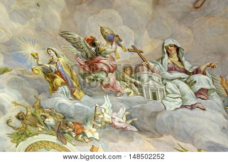 VIENNA AUSTRIA - NOVEMBER 232013: The Karlskirche (St. Charles's Church). Vibrant frescoes of saints and angels decorate the vaulted interior dome of Viennas Karlskirche.