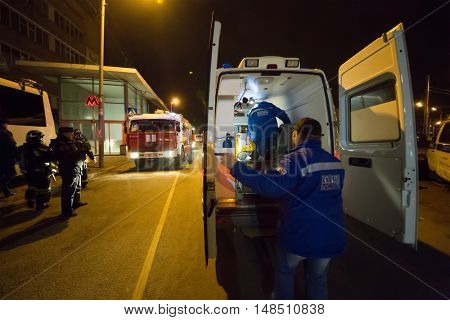 RUSSIA, MOSCOW - FEB 26, 2015: Ambulance and fire-engine with firefighters, paramedics are standing at Preobrazhenskaya ploshchad subway.