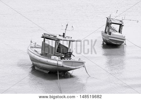 Fishing boat on the sea black and white tone