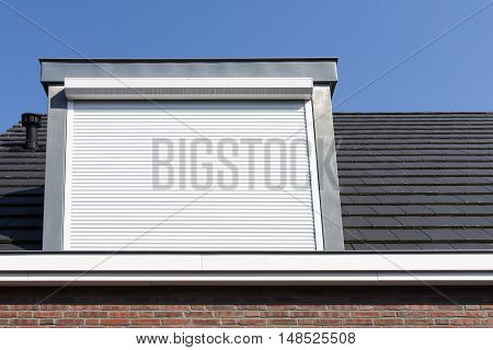 Dormer window with rolling safety shutter in the Netherlands