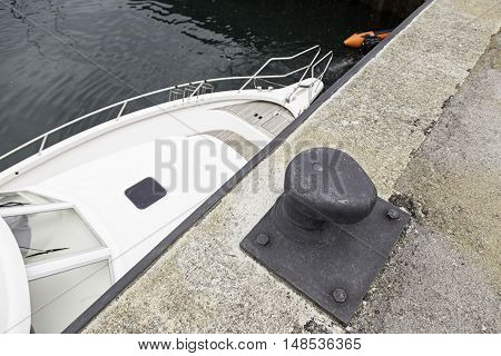 Marine dock detail of a place to tie dock and boats